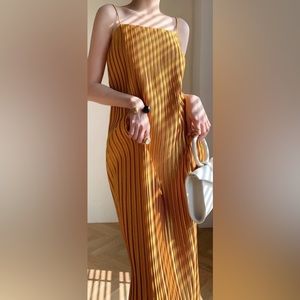 Pleated yellow gold spaghetti strap dress